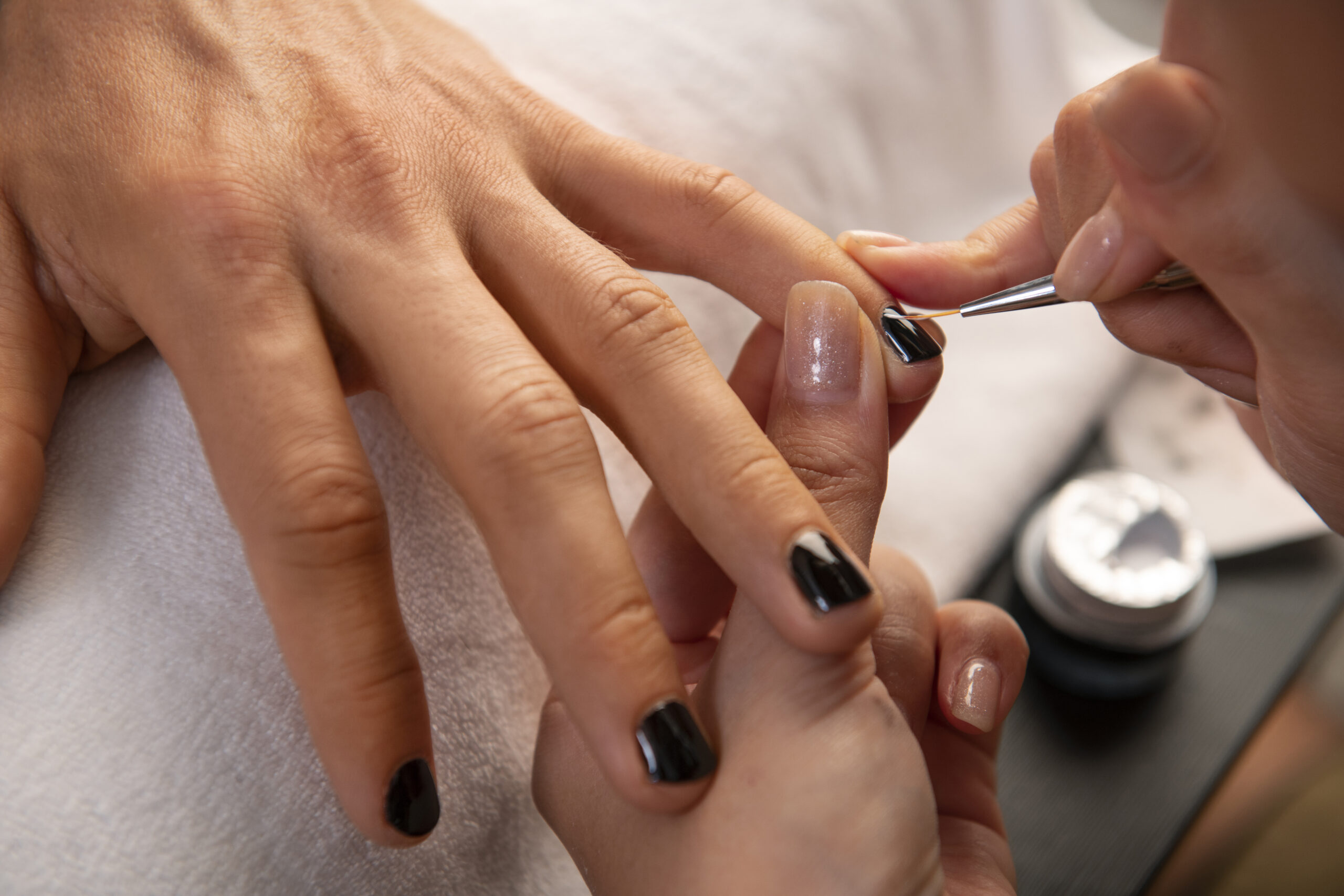 man-getting-manicure-high-angle man getting manicure high angle scaled